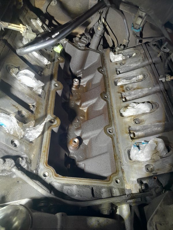 Underside view of an engine block during mechanical work